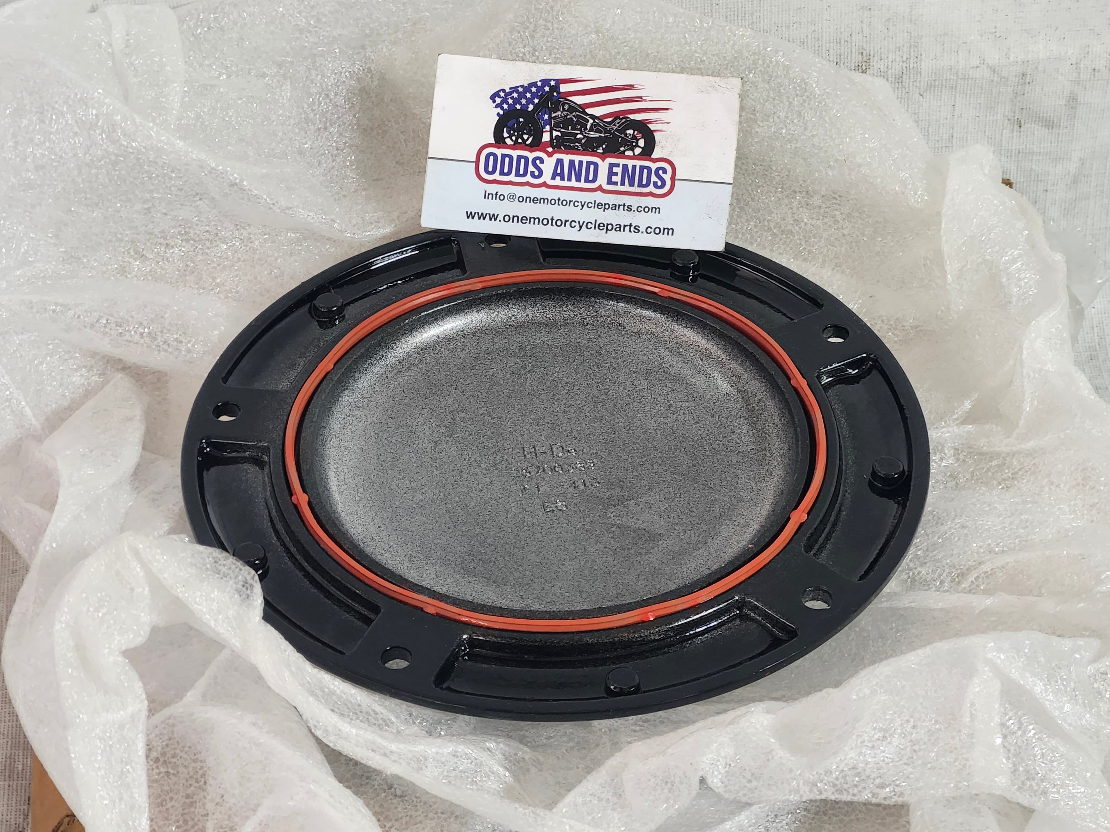 Motorcycle part on a white background with 'Odds and Ends' branding.